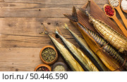 top view smoked fishes wooden table. Стоковое фото, агентство Ingram Publishing / Фотобанк Лори