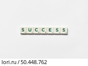 Word success formed of scrabble tiles on white background, still life with copy space.. Success formed of scrabble tiles on white background. Стоковое фото, агентство Ingram Publishing / Фотобанк Лори