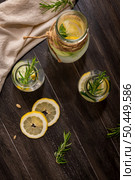Water flavored with lemon, cucumber and rosemary leaves. Стоковое фото, агентство Ingram Publishing / Фотобанк Лори
