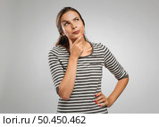 Portrait of a beautiful woman with a thinking expression. Стоковое фото, агентство Ingram Publishing / Фотобанк Лори