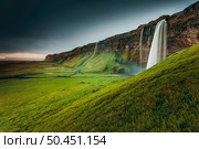 The amazing Seljalandsfoss waterfall in Iceland. Стоковое фото, агентство Ingram Publishing / Фотобанк Лори