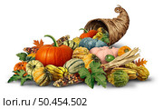 Thanksgiving Cornucopia horn object full of fresh fruit and vegetables on a white background as a rustic traditional wicker or weaved basket with Autumn and Fall season agricultural produce harvest. Стоковое фото, агентство Ingram Publishing / Фотобанк Лори