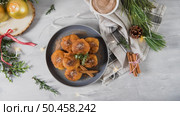 Traditional portuguese Christmas sweets Sonhos with sugar and cinnamon on kitchen countertop. Стоковое фото, агентство Ingram Publishing / Фотобанк Лори