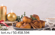 Traditional portuguese Christmas sweets Sonhos with sugar and cinnamon on kitchen countertop. Стоковое фото, агентство Ingram Publishing / Фотобанк Лори