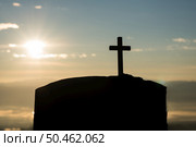 Silhouette of catholic cross and sunrise. Стоковое фото, агентство Ingram Publishing / Фотобанк Лори