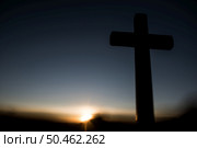 Silhouette of catholic cross and sunrise. Стоковое фото, агентство Ingram Publishing / Фотобанк Лори
