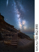 Milky Way and stairs on the beach at summer starry night. Summer in Lefkada, Greece. Beautiful landscape with sky with bright stars and milky way, meteorite, steps, sandy beach, rock, sea coast. Space. Milky Way and stairs on the beach at summer starry night. Стоковое фото, агентство Ingram Publishing / Фотобанк Лори