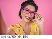 Beautiful Fashion women take a photo selfie with her phone. Стоковое фото, агентство Ingram Publishing / Фотобанк Лори