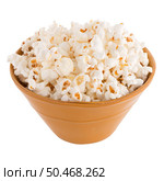 Popcorn in a orange bowl on a white background. Стоковое фото, агентство Ingram Publishing / Фотобанк Лори