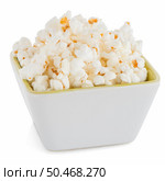 Popcorn in a white bowl on a white background. Стоковое фото, агентство Ingram Publishing / Фотобанк Лори