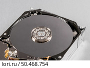 Open computer hard disk drive (HDD) closeup. Стоковое фото, агентство Ingram Publishing / Фотобанк Лори