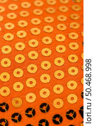 Bright orange paillette texture background. Стоковое фото, агентство Ingram Publishing / Фотобанк Лори