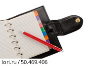 Open note book with lined pages free date space and red pencil. Стоковое фото, агентство Ingram Publishing / Фотобанк Лори