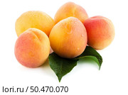 Sweet peaches with leafs on a white background. Стоковое фото, агентство Ingram Publishing / Фотобанк Лори