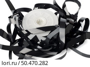 Pile of videotape reels on  white reflective background. Стоковое фото, агентство Ingram Publishing / Фотобанк Лори