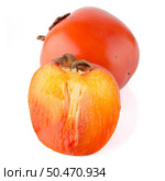 Ripe persimmons on white background. Стоковое фото, агентство Ingram Publishing / Фотобанк Лори