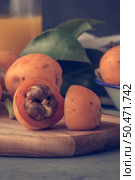loquats on kitchen counter background. Vintage style. Стоковое фото, агентство Ingram Publishing / Фотобанк Лори