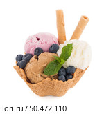 Ice cream scoops in wafer bowl on white background. Стоковое фото, агентство Ingram Publishing / Фотобанк Лори