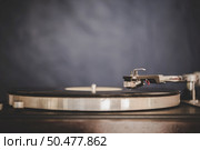 Spinning Record Player With Vintage Vinyl, Turntable Player And Vinyl Record. Стоковое фото, агентство Ingram Publishing / Фотобанк Лори