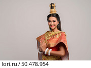 Women wearing Thai clothing that Pay respect,sawasdee symbol. Стоковое фото, агентство Ingram Publishing / Фотобанк Лори
