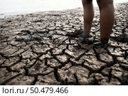 Children are walking barefoot on mud,selective focus. Стоковое фото, агентство Ingram Publishing / Фотобанк Лори