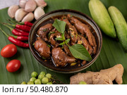Joints and chicken feet stewed in a cup with chili tomato, cucumber, garlic and ginger. Стоковое фото, агентство Ingram Publishing / Фотобанк Лори