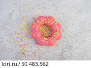strawberry donut decorated icing and sprinkling on the floor. Стоковое фото, агентство Ingram Publishing / Фотобанк Лори