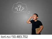 The boy is confused, not knowing where to go. Стоковое фото, агентство Ingram Publishing / Фотобанк Лори