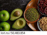 legumes and fruit on a black cement floor background. Стоковое фото, агентство Ingram Publishing / Фотобанк Лори