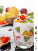 Fruit Yogurt Smoothie in glass on wooden. Selective focus. Стоковое фото, агентство Ingram Publishing / Фотобанк Лори