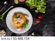 Shrimp fried rice with tomatoes Carrots and scallions on the plate. Стоковое фото, агентство Ingram Publishing / Фотобанк Лори