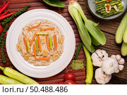 Stir-fried golden needle mushroom in a white plate with garlic. Carrots and asparagus. Стоковое фото, агентство Ingram Publishing / Фотобанк Лори