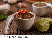 Nam phrik kapi  with Chili and Lemon on wooden floor. Стоковое фото, агентство Ingram Publishing / Фотобанк Лори