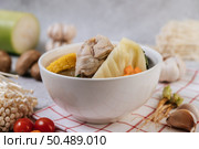 Chicken soup with corn, shiitake mushroom, enoki mushroom, and carrot. Стоковое фото, агентство Ingram Publishing / Фотобанк Лори