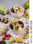Chicken soup with corn, shiitake mushroom, enoki mushroom, and carrot. Стоковое фото, агентство Ingram Publishing / Фотобанк Лори