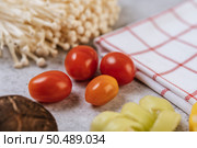 Enokitake, tomato, Shiitake Mushroom, and red white cloth. Selective focus. Стоковое фото, агентство Ingram Publishing / Фотобанк Лори