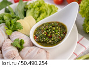 Squid stuffed with cooked pork with seafood sauce. Стоковое фото, агентство Ingram Publishing / Фотобанк Лори