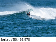 Bodyboarder surfing ocean wave on a sunny winter day. Стоковое фото, агентство Ingram Publishing / Фотобанк Лори