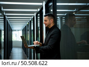 Businessman in the corridor in the conference room Relax with various posture before presenting work and new projects to the management team for consideration in the meeting room. Стоковое фото, агентство Ingram Publishing / Фотобанк Лори