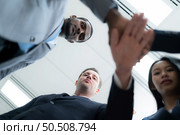Businesspeople can motivate each other by joining hands. Стоковое фото, агентство Ingram Publishing / Фотобанк Лори