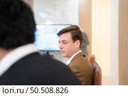 Group of young businessmen in international companies, Meeting to conclude a new responsible project. Стоковое фото, агентство Ingram Publishing / Фотобанк Лори