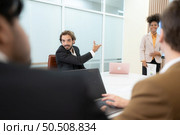 Group of young businessmen in international companies, Meeting to conclude a new responsible project. Стоковое фото, агентство Ingram Publishing / Фотобанк Лори