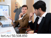 Group of young businessmen in international companies, Meeting to conclude a new responsible project. Стоковое фото, агентство Ingram Publishing / Фотобанк Лори