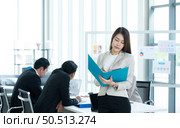Portrait of an Asian female rookie in the new entrepreneurial team in the business of investment services. Стоковое фото, агентство Ingram Publishing / Фотобанк Лори