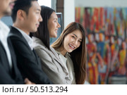 Young asian woman freshman joined the group of young entrepreneurs with three seniors on the team. Welcomed and introduced to senior management. Стоковое фото, агентство Ingram Publishing / Фотобанк Лори
