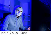 This is the face of a hacker who is knowledgeable with operating systems and other programs. He will exploit flaws and breach the computer system to cause damage. Стоковое фото, агентство Ingram Publishing / Фотобанк Лори