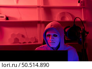 This is the face of a hacker who is knowledgeable with operating systems and other programs. He will exploit flaws and breach the computer system to cause damage. Стоковое фото, агентство Ingram Publishing / Фотобанк Лори