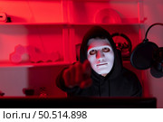 This is the face of a hacker who is knowledgeable with operating systems and other programs. He will exploit flaws and breach the computer system to cause damage. Стоковое фото, агентство Ingram Publishing / Фотобанк Лори