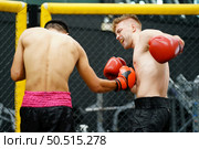 Muay Thai, The martial art of Thailand, The power of the fist that punches into the opponent’s be colic, choke and can lose by knockout. Стоковое фото, агентство Ingram Publishing / Фотобанк Лори