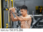 Mixed martial arts fighter going to the gym to build strong muscles To help make the collision more intense and help reduce injuries from punching as well. Стоковое фото, агентство Ingram Publishing / Фотобанк Лори